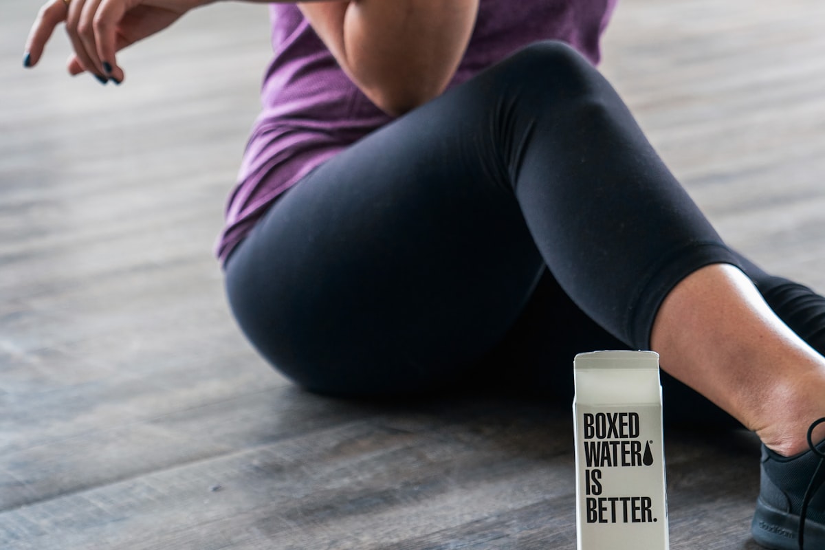 Woman stretching and doing yoga as part of recovery routine