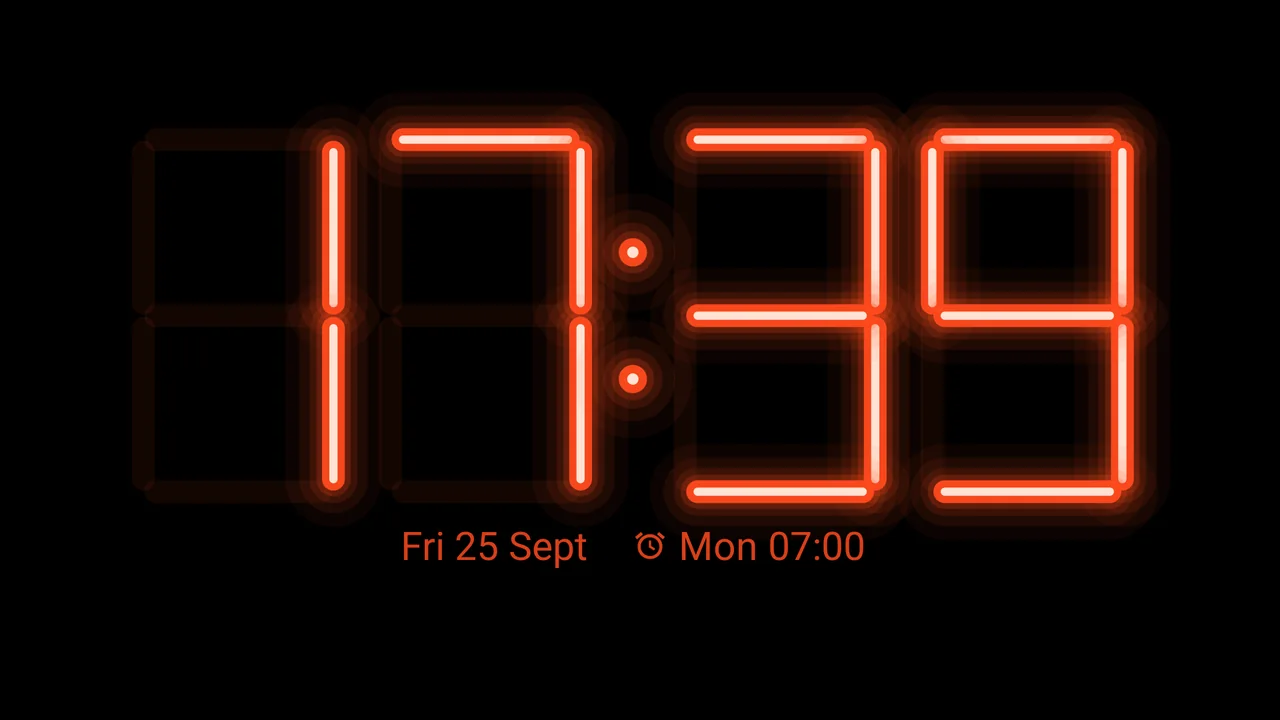 The neon clock face on the cover screen of a foldable standing like a tent